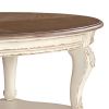 Two Tone Oval Cocktail Table with Bottom Shelf, Antique White and Brown